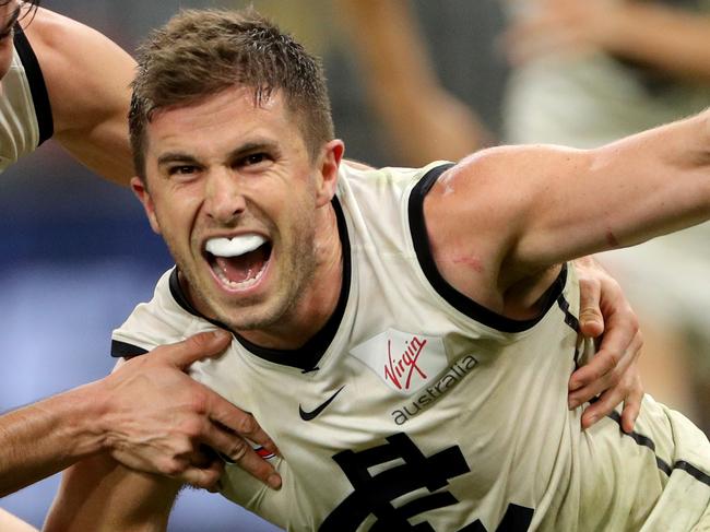 Marc Murphy (right) of the Blues celebrates after kicking a goal during the Round 15 AFL match between the Fremantle Dockers and the Carlton Blues at Optus Stadium in Perth, Sunday, June 30, 2019. (AAP Image/Richard Wainwright) NO ARCHIVING, EDITORIAL USE ONLY