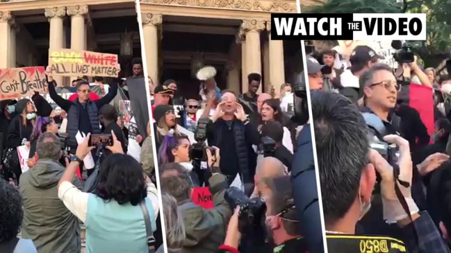 Sydney protester booed and chased out of rally for holding 'all lives matter' sign