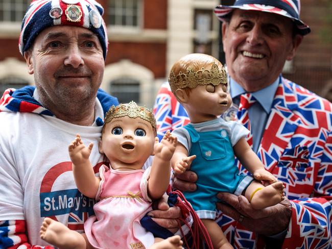 Royal fans John Loughrey (left) and Terry Hutt (right) pose with baby dolls outside the Lindo Wing of St Mary’s Hospital, where they have been waiting for two weeks. Picture: Jack Taylor/Getty Images.