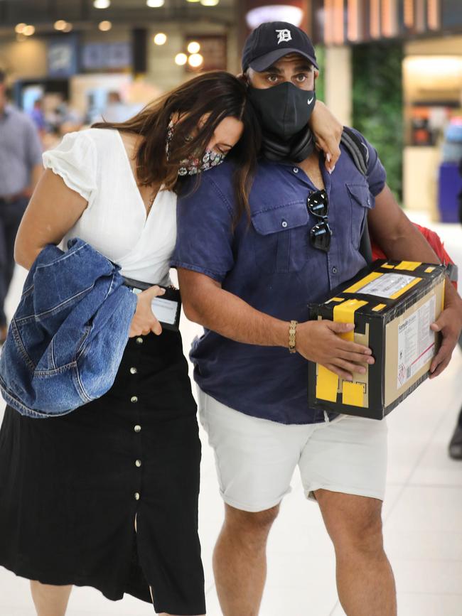 Greg Jenkins with sister Jen Bowen arrives at Adelaide Airport last year carrying his mother Anna’s remains which were handed to him by Malaysian police in open plastic bags in an unsealed cardboard box. Picture Dean Martin