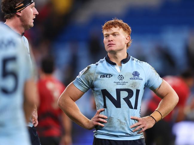 A dejected Tane Edmed looks on after the Waratahs’ loss to the Crusaders. Picture: Getty Images