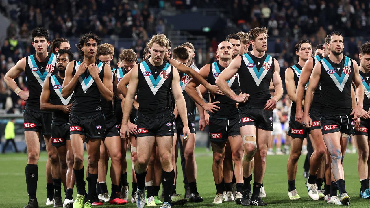 Dejected Port Adelaide players walk off GMHBA Stadium on Saturday night. Picture: Mark Stewart