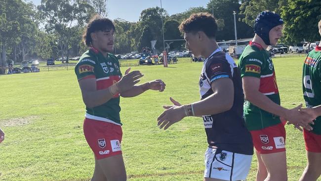 The Burleigh Bears and Wynnum-Manly players exchange handshakes