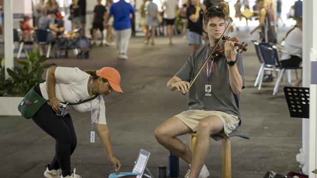 18-year-old violinist Ben Rawlings busking at the Adelaide Showground Farmers' Market in March. Picture: Brett Hartwig