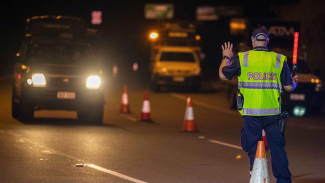 Police working on the Queensland border. Photo: Glenn Hunt.