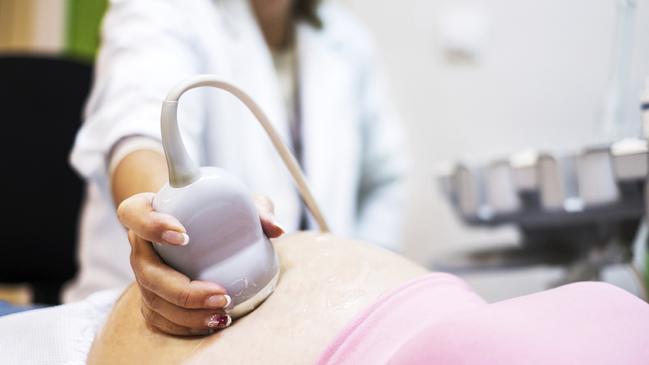 A woman attending a maternity appointment at a hospital.