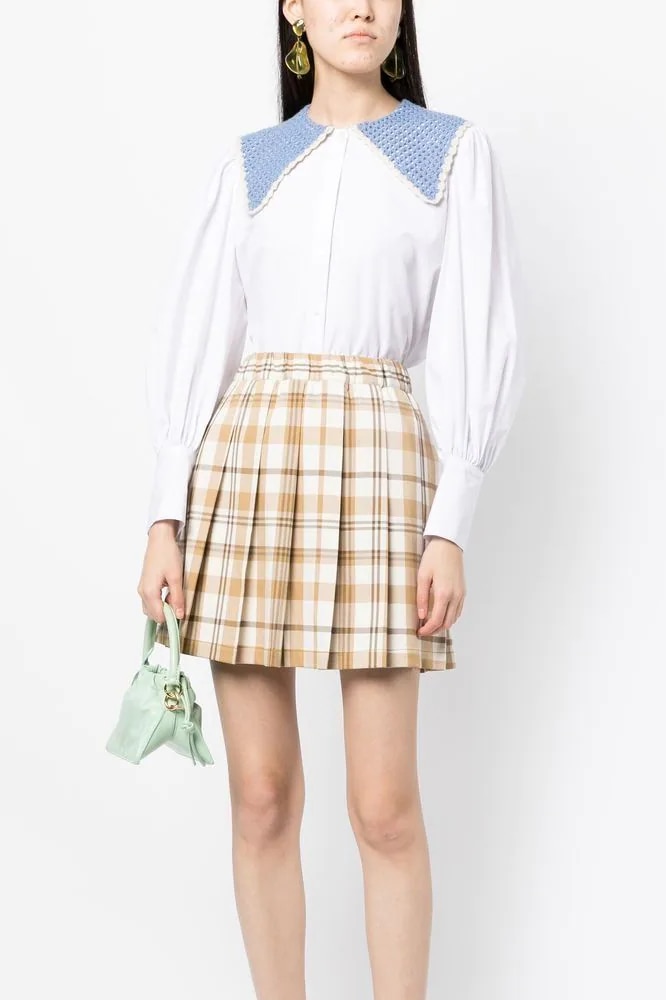 <h3><a href="https://www.farfetch.com/au/shopping/women/designer-chocoolate/items.aspx" target="_blank" rel="nofollow noopener"><b>Chocoolate</b></a></h3><p>School uniforms have been a centrepiece of the runways for seasons now—check our longstanding preoccupation with ties, button down shirts, and scrunched socks in loafers. This plaid mini skirt from Chocoolate continues that trend. Carry it into the fall winter season with a quilted jacket and slouchy tote.</p><p><b>Category: </b>Bottoms | <b>Material: </b>Polyester |<b> Colour(s): </b>Brown check | <b>Delivery: </b>Free shipping over $300</p><p><b>SHOP NOW: </b>Chocoolate tartan-print flared mini skirt, $226 from <a href="https://www.farfetch.com/au/shopping/women/chocoolate-tartan-print-flared-mini-skirt-item-19595442.aspx" target="_blank" rel="nofollow noopener"><b>Farfetch</b></a></p>