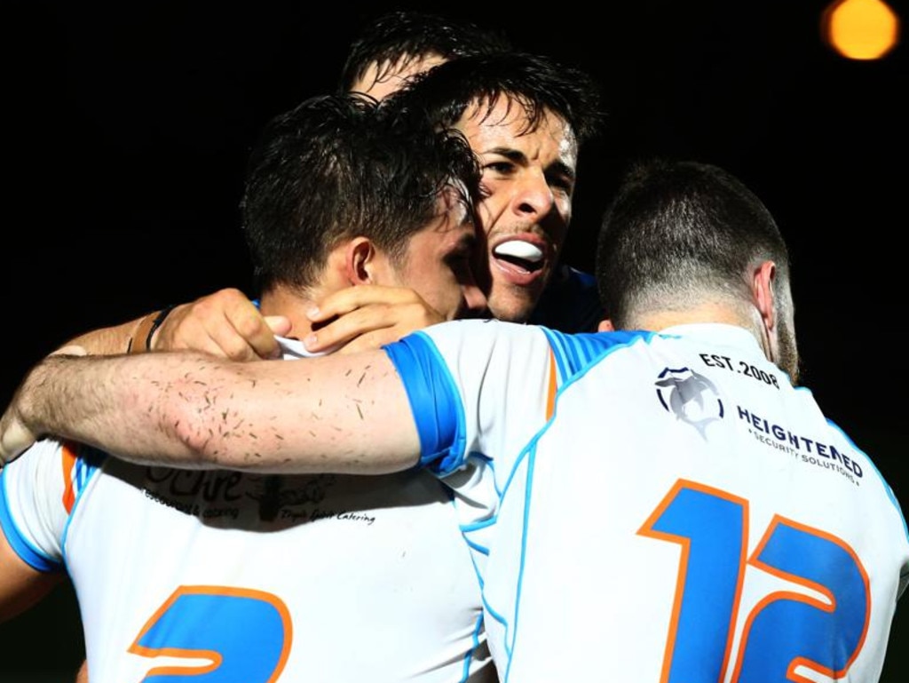 Pride's Matt Egan (centre), celebrates Shawn Bowen's (left) match-levelling try with Ewan Moore (right)..