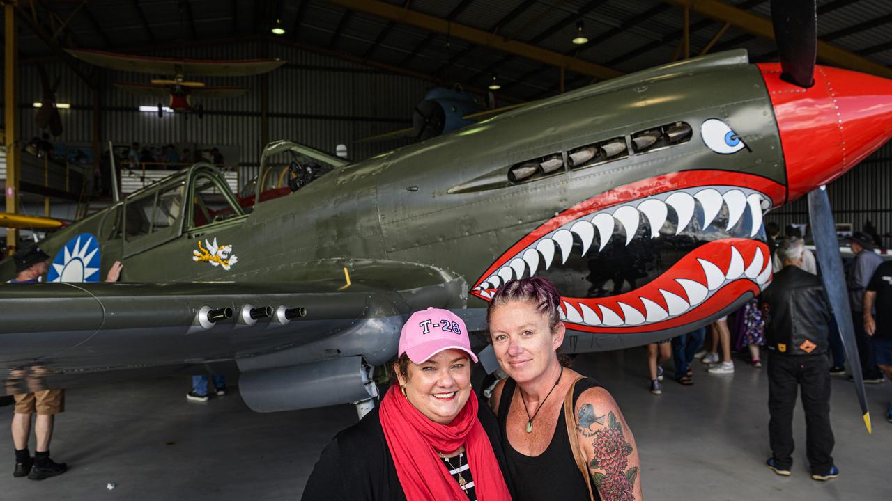Annamaria Zuccoli (left) and Sarah Jones with a P40 Kittyhawk WWII American that lent air support to the 25th Battalion at Milne Bay on display at the David Hack Classic, Sunday, May 18, 2025. Picture: Kevin Farmer