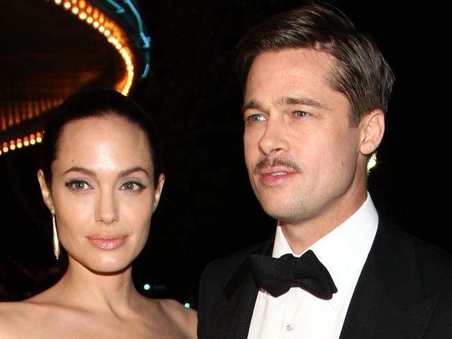 WESTWOOD, CA - DECEMBER 08:  Actress Angelina Jolie and actor Brad Pitt arrive at the premiere of Paramount's "The Curious Case Of Benjamin Button" held at Mann's Village Theatre on Decemeber 8, 2008 in Westwood, California.  (Photo by Alberto E. Rodriguez/Getty Images)