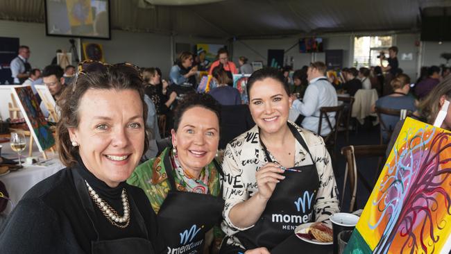 Participating in the World's Largest Paint and Sip Luncheon are (from left) Tarn McLean, Sarah Cerqui and Jessica Ritchie for Momentum Mental Health at Clifford Park racecourse, Friday, June 21, 2024. Picture: Kevin Farmer