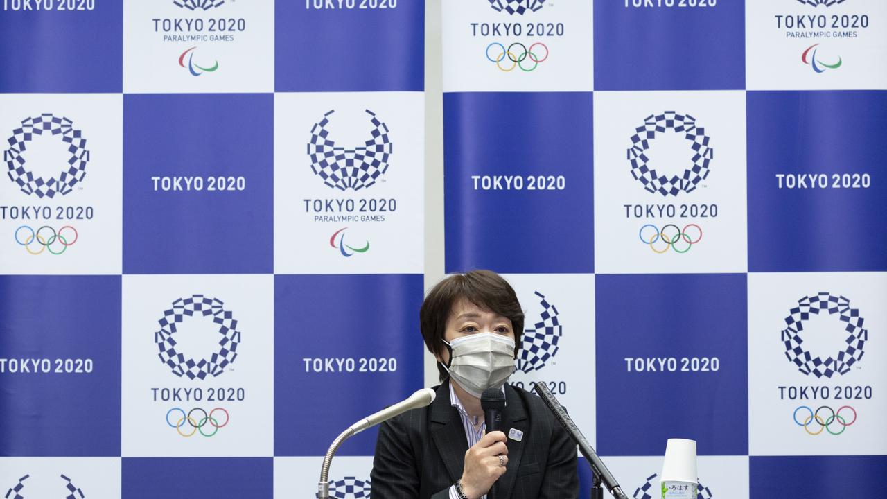 Tokyo 2020 Olympics Organising Committee president Seiko Hashimoto talks to journalists in front of the Tokyo 2020 Olympic and Paralympic emblems. Picture: Getty Images
