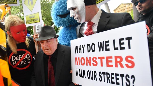 Vivian Frederick Deboo spent his last moments of freedom crossing a “monster’s walk” created by his victims and their supporters. Picture: AAP/David Mariuz.