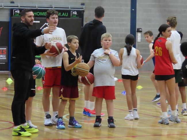 NBL stalwart Adam Gibson puts some youngsters through their paces at a basketball clinic in Launceston. Picture: Jon Tuxworth