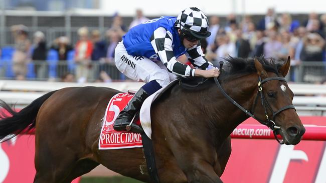 Ryan Moore wins the 2014 Emirates Melbourne Cup aboard Protectionist at Flemington Racecourse on Melbourne Cup Day TrackSnaps 2014 Picture: Stephen Harman