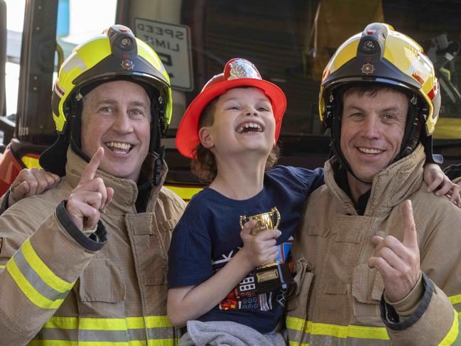 September 3, 2024:  book week winner, Texas Flynn with fire fighters Kym England, Brett Maher, Mark Willoughby and Will Rivers at Adelaide station Picture: Kelly Barnes