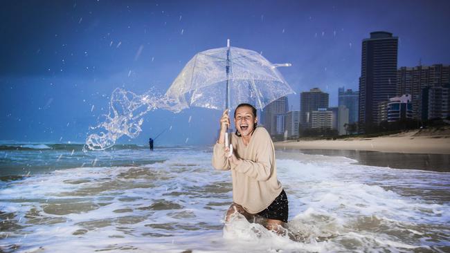 Jess Peterson, 25 from Mermaid Beach didn’t let the rain stop her from a morning walk at Narrowneck on the Gold Coast. Photo – Nigel Hallett