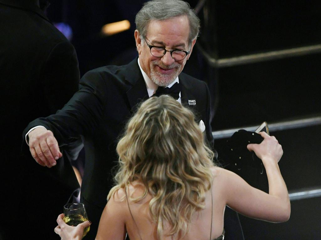 Jennifer Lawrence greets director Steven Spielberg in the audience during the 90th Annual Academy Awards at the Dolby Theatre on March 4, 2018 in Hollywood, California. Picture: AFP