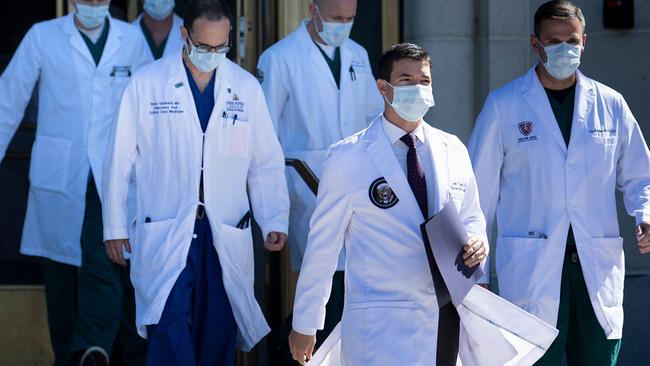 White House physician Sean Conley, second from right, with medical staff, arrives to give an update on the condition of US President Donald Trump. Picture: AFP