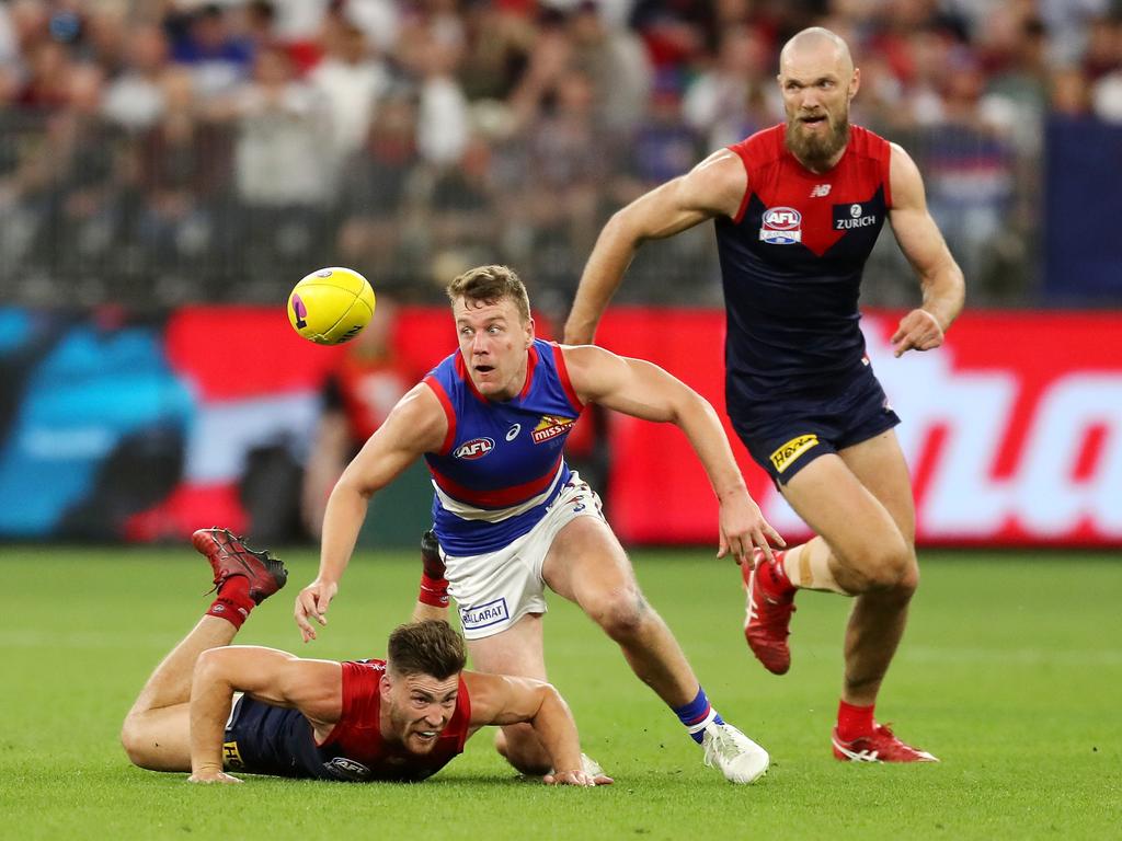 Jack Macrae of the Bulldogs chases the ball. Picture: Will Russell/AFL Photos via Getty Images