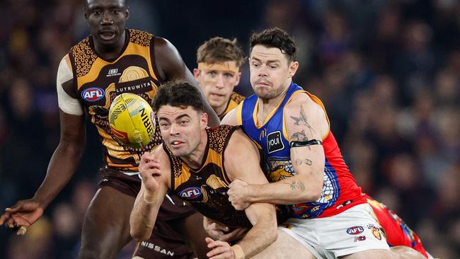 Lachie Neale tackles Conor Nash. Picture: Dylan Burns/AFL Photos via Getty Images