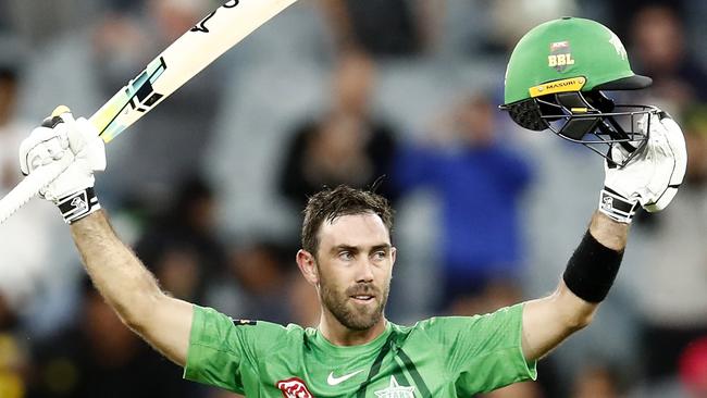 MELBOURNE, AUSTRALIA - DECEMBER 15:  Glenn Maxwell of the Melbourne Stars raises his bat after scoring 100 runs during the Men's Big Bash League match between the Melbourne Stars and the Sydney Sixers at Melbourne Cricket Ground, on December 15, 2021, in Melbourne, Australia. (Photo by Darrian Traynor/Getty Images)