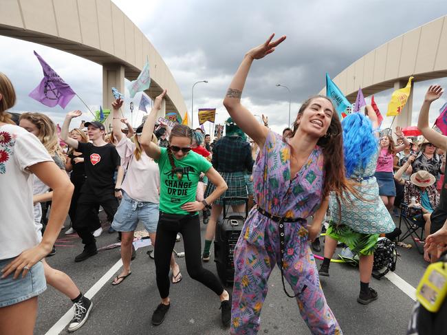 An Extinction Rebellion protest on Brisbane’s William Jolly Bridge. Those who air a contrary view are howled down and branded a “denier”, writes Mike O’Connor. Picture: Annette Dew