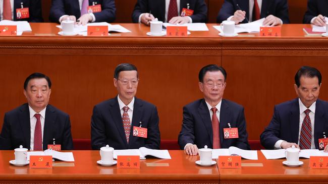 Delegates Wang Chen, Zhang Gaoli, He Guoqiang and Wu Guanzheng attend the opening session of the 20th National Congress of the Communist Party of China (CPC) at the Great Hall of the People on October 16.