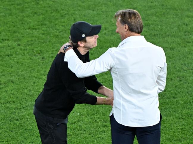 France coach Herve Renard (left) congratulates his Matildas counterpart Tony Gustavsson. Picture: WILLIAM WEST / AFP