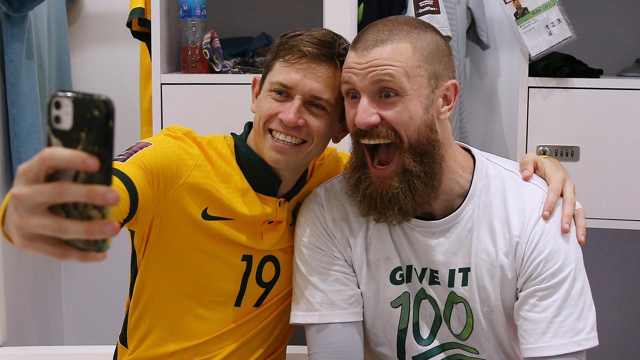Craig Goodwin and Andrew Redmayne were all smiles after the Socceroos’ win. Picture: Mohamed Farag/Getty Images
