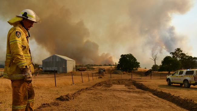 A Rural Fire Service firefighter Trevor Stewart views a flank of a fire on January 11, 2020 in Tumburumba, Australia. Picture: Getty Images