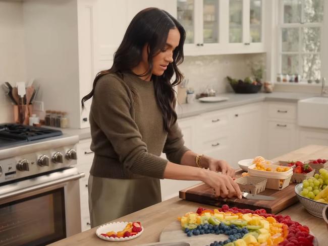 Meghan Markle perfecting her rainbow fruit platter on her Netflix series.