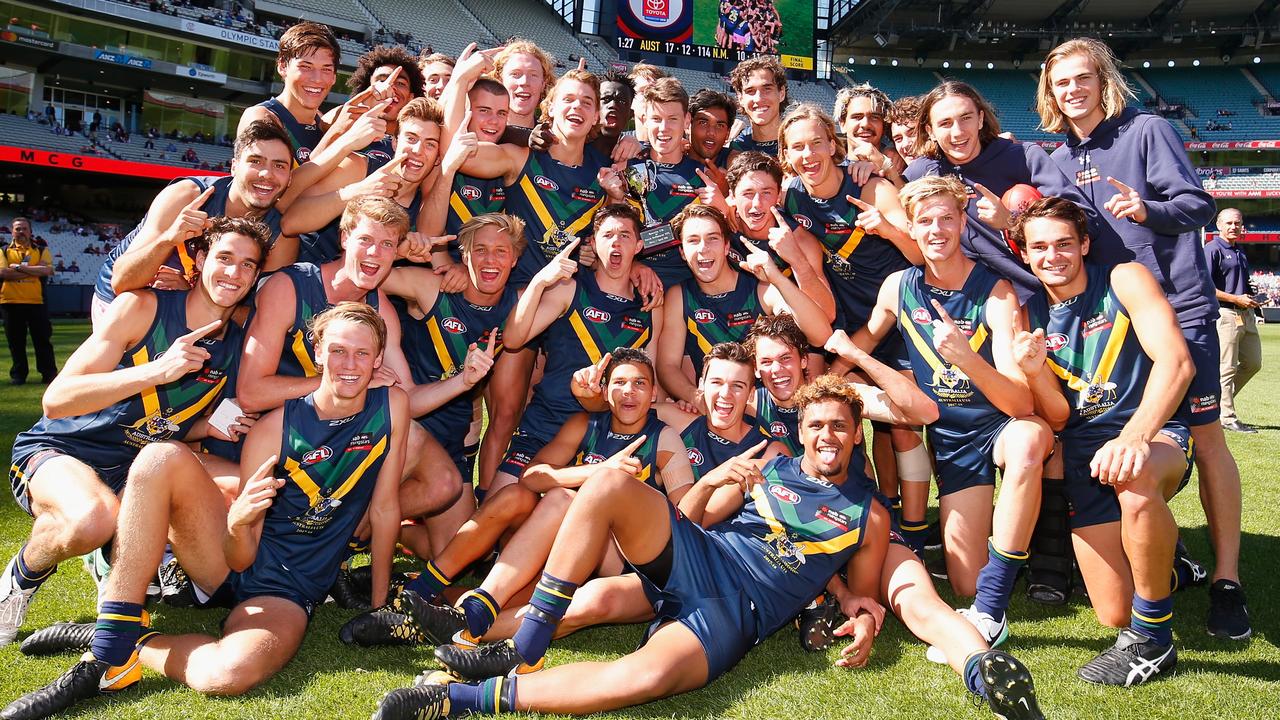 The AFL Academy team celebrates after defeating North Melbourne’s VFL side in early April. (Photo by Darrian Traynor/AFL Media/Getty Images)