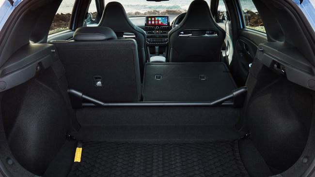 Boot space in the Hyundai i30N is about 380 litres, and the rear seats fold 60-40.