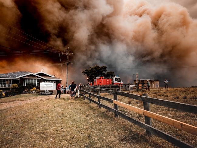 26-10-19 - Property under threat from smoke in Black Head, NSW. Martin Von Stoll