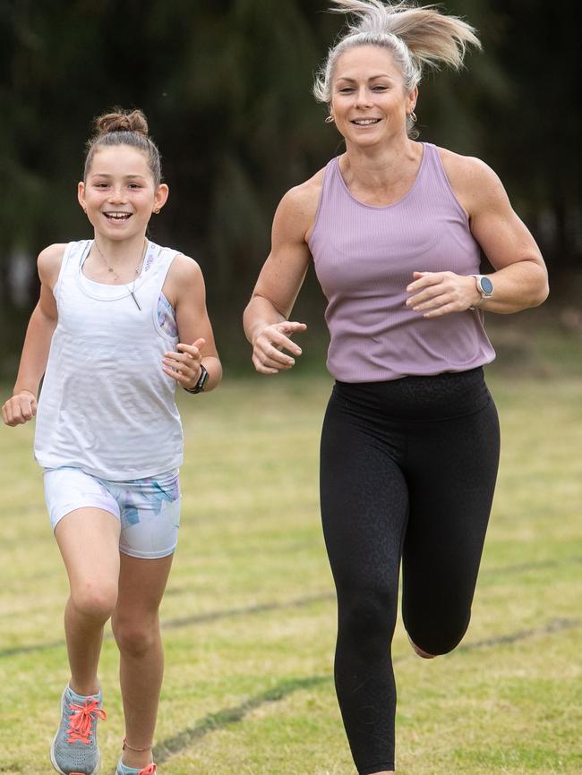 Cassie Gill, with daughter Keira, says families can save 60 per cent on their Little Athletics registration fees by using Active Kids vouchers. Picture: Julian Andrews