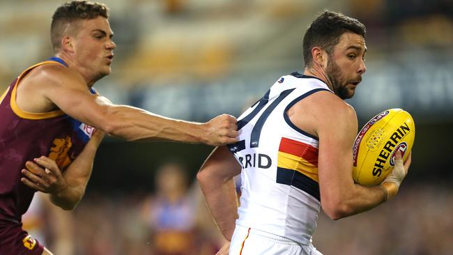 Rory Atkins tries to evade a Tom Cutler tackle. Picture: AAP Image/Jono Searle