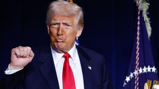 TOPSHOT - US President Donald Trump gestures as he arrives to speak during the National Prayer Breakfast at the Washington Hilton in Washington, DC, on February 6, 2025. (Photo by Ting Shen / AFP)