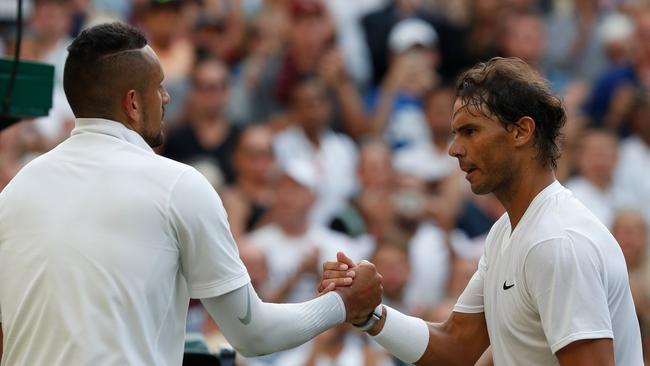 Nick Kyrgios (left) and Rafael Nadal shake hands after the Spaniard’s four-set Wimbledon second round victory overnight. Picture: AFP