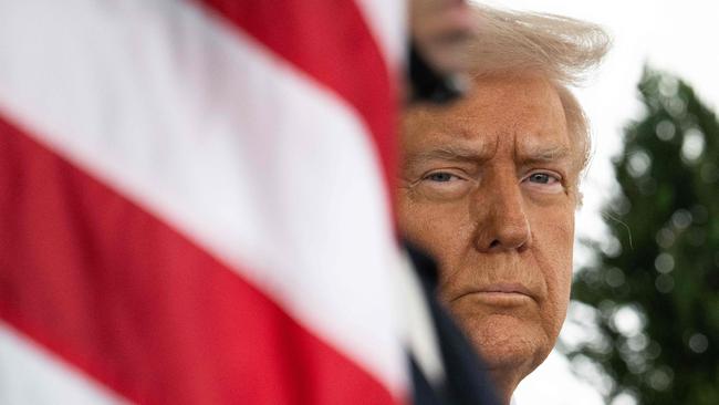 TOPSHOT - US President Donald Trump waits outside of the West Wing before welcoming King Abdullah II of Jordan to the White House in Washington, DC, on February 11, 2025. (Photo by Jim WATSON / AFP)