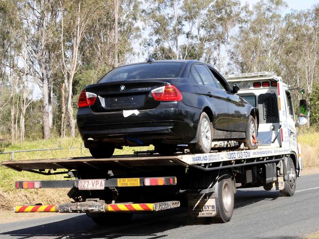 A car is being removed by a tow truck upon police direction, Emergency services Fire, Police and Ambulance attend a house fire where a large family are stable after being transported to hospital following a house fire in Kholo. , Tuesday 2nd July 2022 - Photo Steve Pohlner