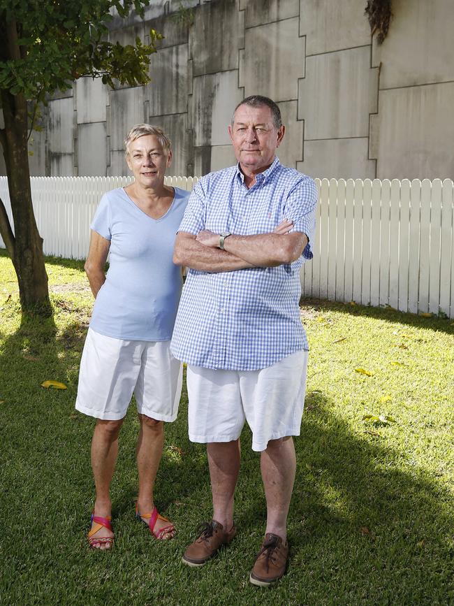 Ellen-May Maddern and Peter Maddern posing at their former property in Clayfield, Brisbane which was bought by the council in 2015. Mr Maddern said it repeatedly flooded after Airport Link was built. Picture: Josh Woning