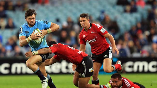 Waratah Adam Ashley-Cooper is tackled against the Crusaders.