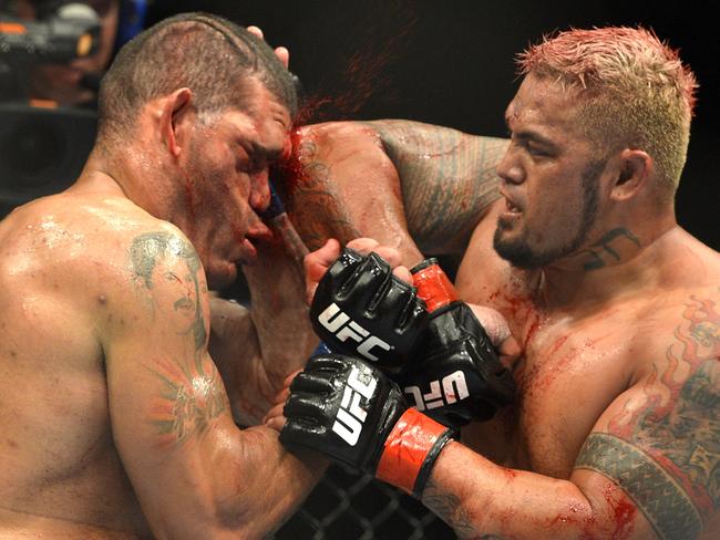 BRISBANE, AUSTRALIA - DECEMBER 07: Mark Hunt connects with an elbow during the UFC Brisbane bout between Mark Hunt and Antonio 'Big Foot' Silva of Brazil at the Brisbane Entertainment Centre on December 7, 2013 in Brisbane, Australia. (Photo by Bradley Kanaris/Getty Images)