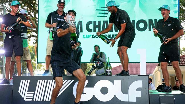 ORLANDO, FLORIDA - APRIL 02: Sebastian Munoz, Mito Pereira, Joaquin Niemann,and David Puig of Torgue GCcelebrate winning the team event at the LIV Golf Invitational - Orlando at The Orange County National on April 02, 2023 in Orlando, Florida.   Mike Ehrmann/Getty Images/AFP (Photo by Mike Ehrmann / GETTY IMAGES NORTH AMERICA / Getty Images via AFP)