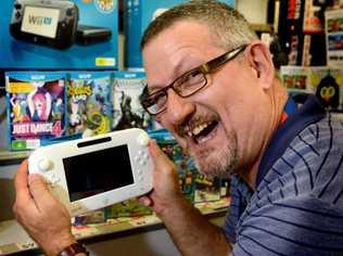 Tweed City Kmart general merchandise manager Randy Hays with the new WiiU. Picture: John Gass