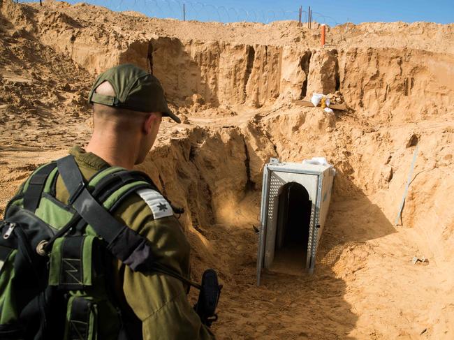 The soldier on the Israeli side of the border with the Gaza Strip near the entrance of a tunnel that Israel says was dug by the Islamic Jihad group, in January 2018. Picture: AFP PHOTO / POOL / JACK GUEZ