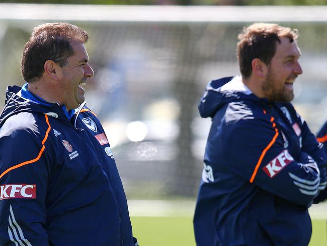 Ange Postecoglou and Peter Cklamovski look over a Melbourne Victory session in 2012-13. Picture: George Salpigtidis