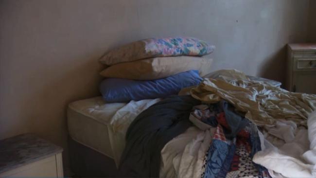 Sheets and bedding left behind by former residents of the rooms.