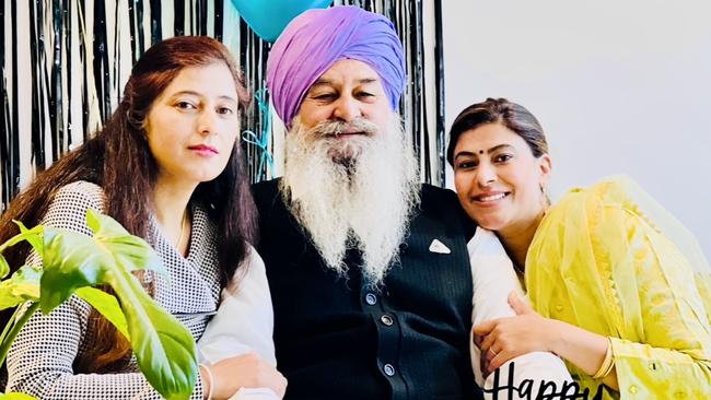 Nishan Singh with his daughters who haven’t left his bedside since he was admitted into hospital. Picture: Supplied by family